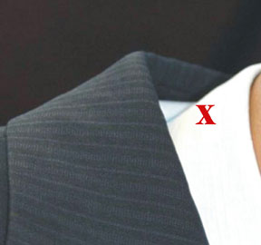 Failed collar due to retail alteration to remove back wrinkle